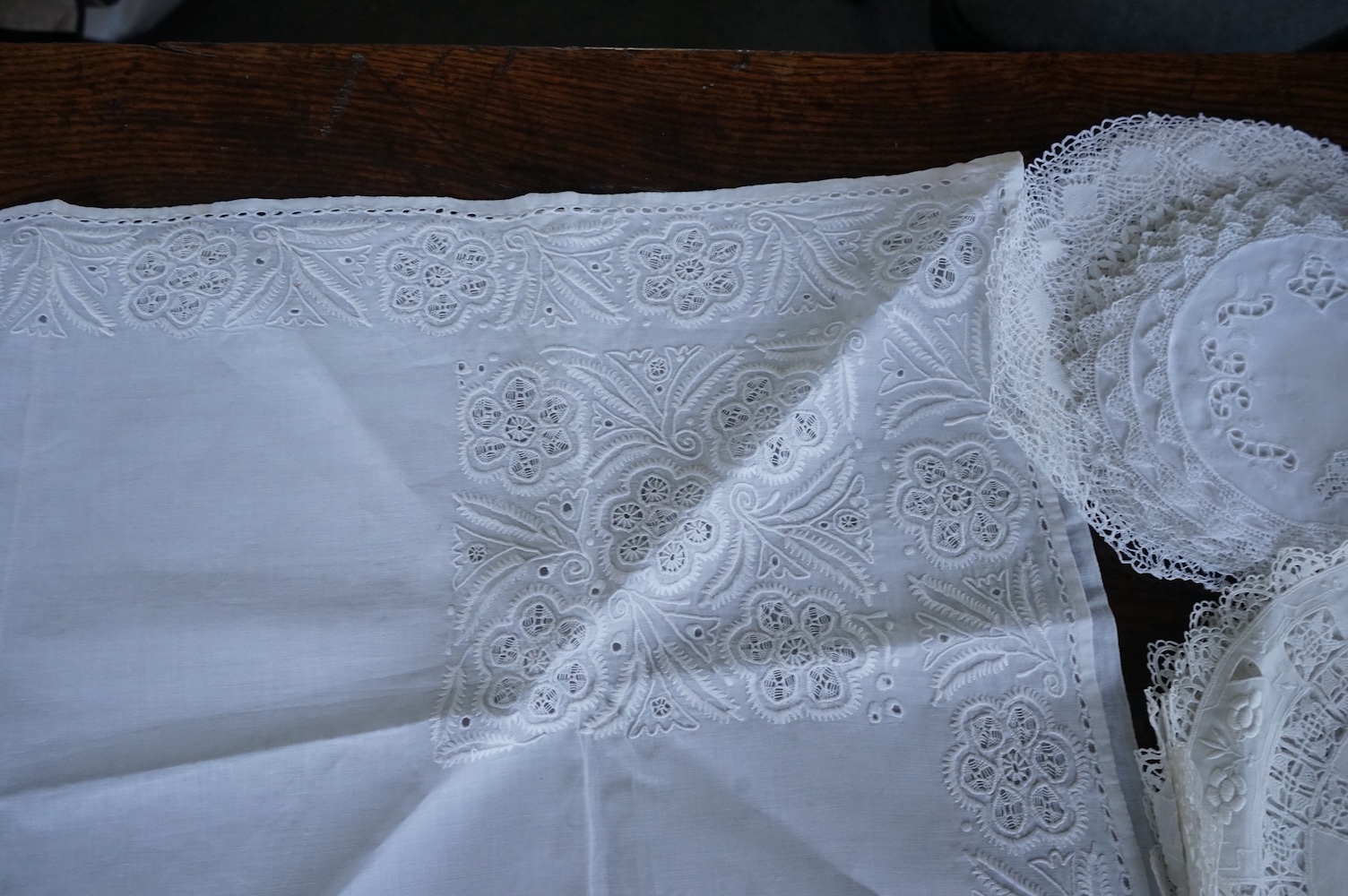 A 19th century large linen cut work collar, together with various sets of circular cut work mats, a tasselled pelmet and a collection of bobbin lace and tatting worked mats etc., Condition - mostly good